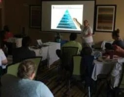 Participants learn about OSIRIS-REx from team member Dolores Hill
