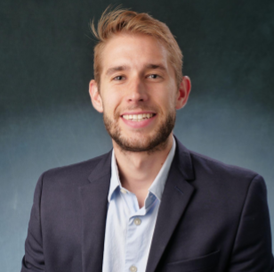 Portrait photo of a young man wearing a suit