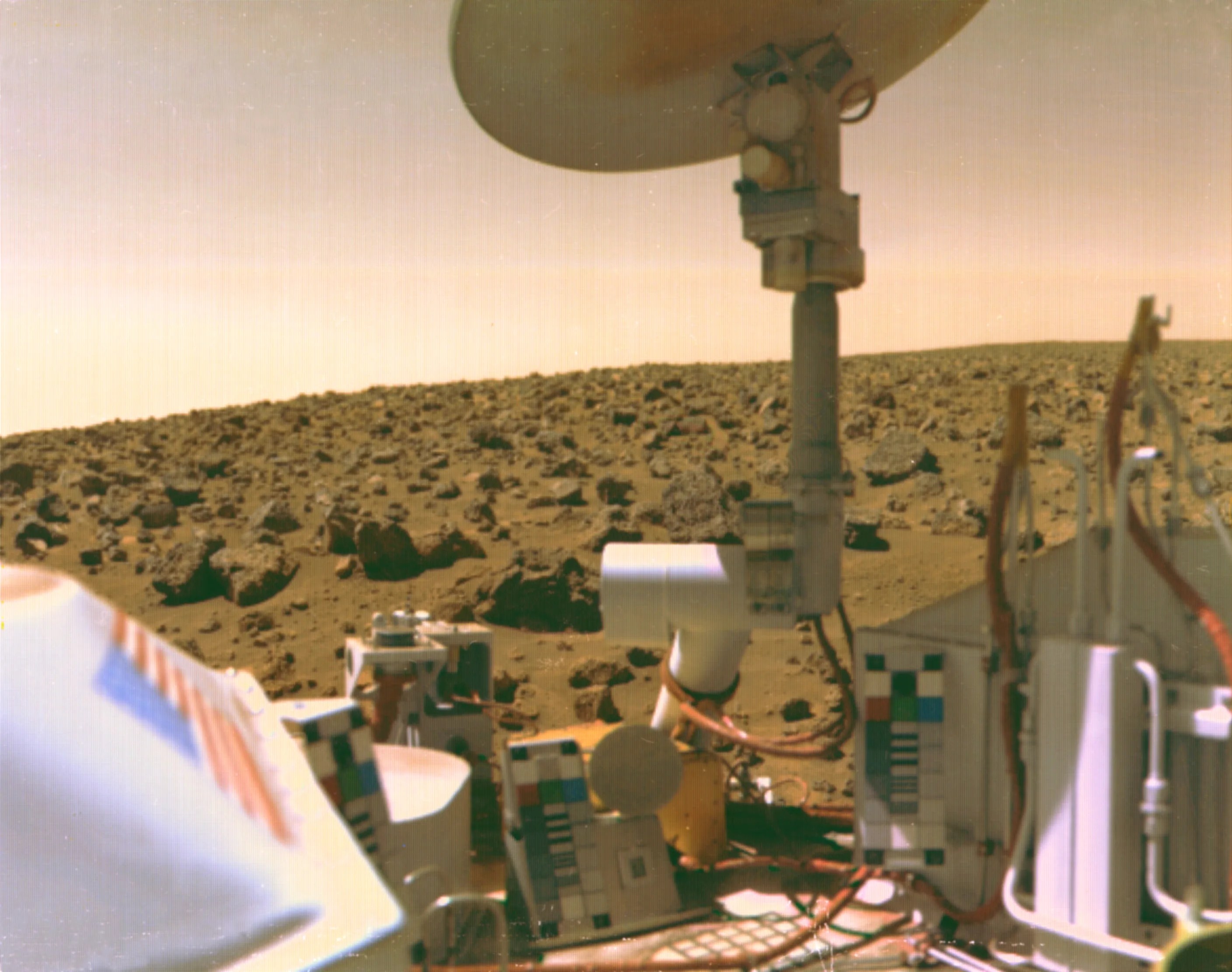 U.S. flag visible on Viking lander with Martian terrain on horizon