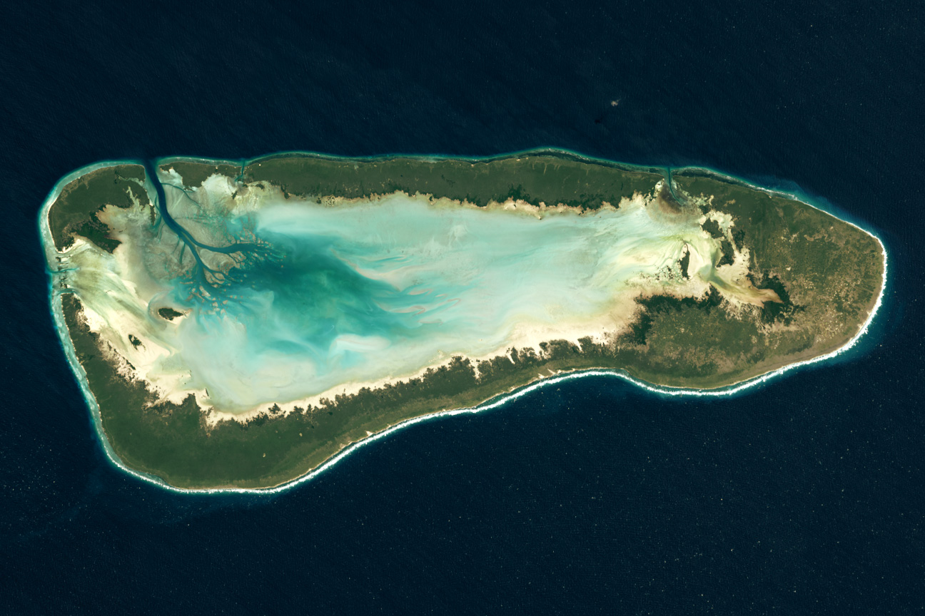 Located more than 400 kilometers (250 miles) northwest of Madagascar and more than 600 kilometers (375 miles) east of mainland Africa, Aldabra is one of the coralline outer islands of the Seychelles. The OLI-2 (Operational Land Imager-2) on Landsat 9 captured this image of the remote atoll on June 24, 2022. Tides flow in and out of the lagoon through channels between the large perimeter islands. The land tops out at a mere 8 meters (26 feet) above sea level.
