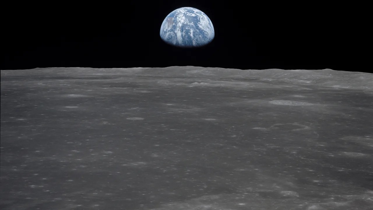 Earth rising above the lunar surface.