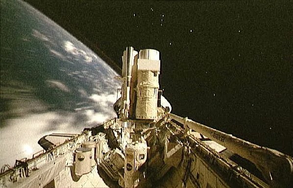 a photo of astro-2 while in the bay of the space shuttle