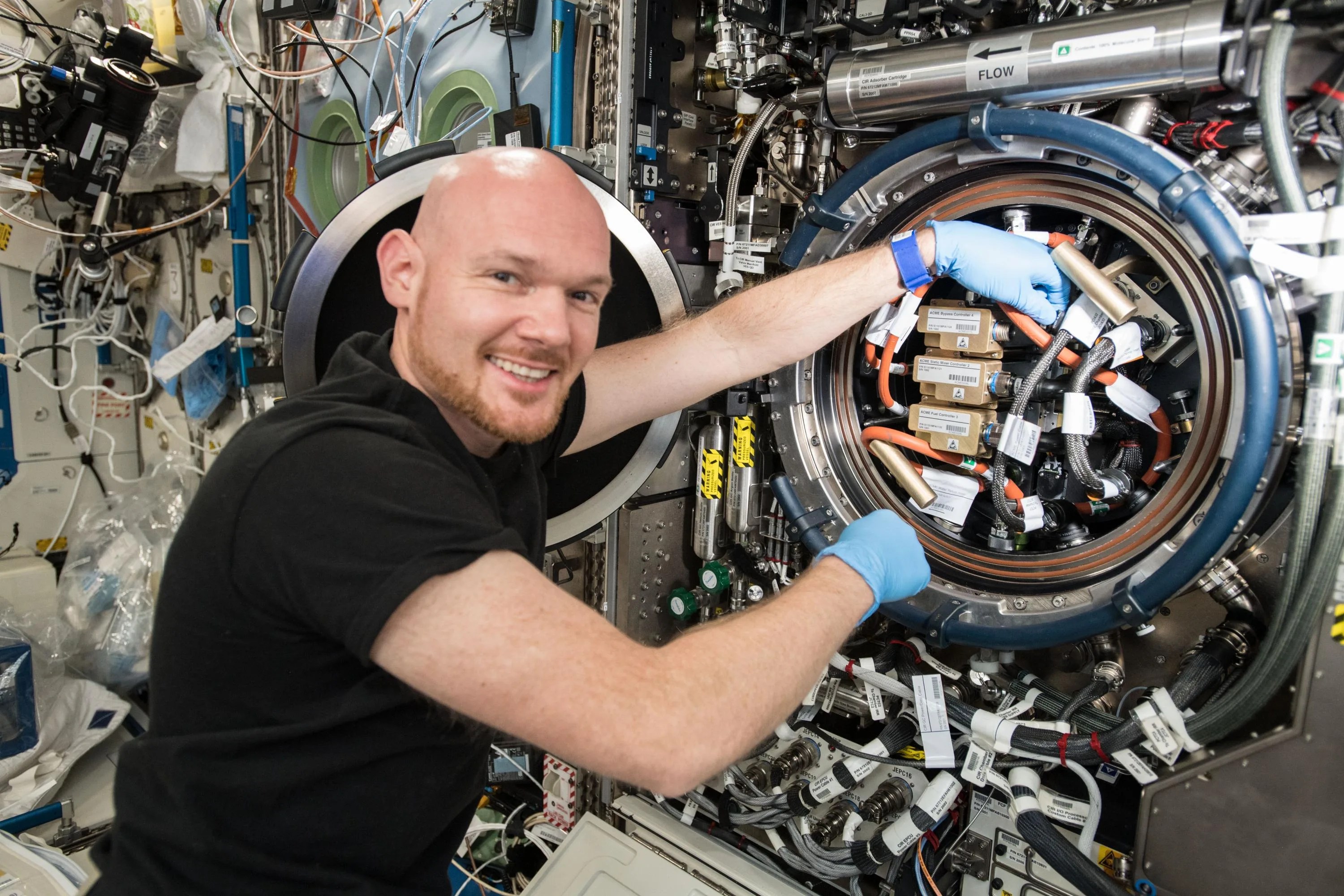 Photo of Astronaut Alexander Gerst replacing a gear on the ISS