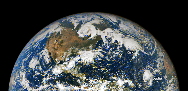 This image shows the Earth from a distance centering on the Atlantic Ocean near Florida. Three storms are visible - Milton, Kirk, and Leslie. Milton is in the Gulf of Mexico, Kirk in the more northern Atlantic, and Leslie nearer the coast of Africa.