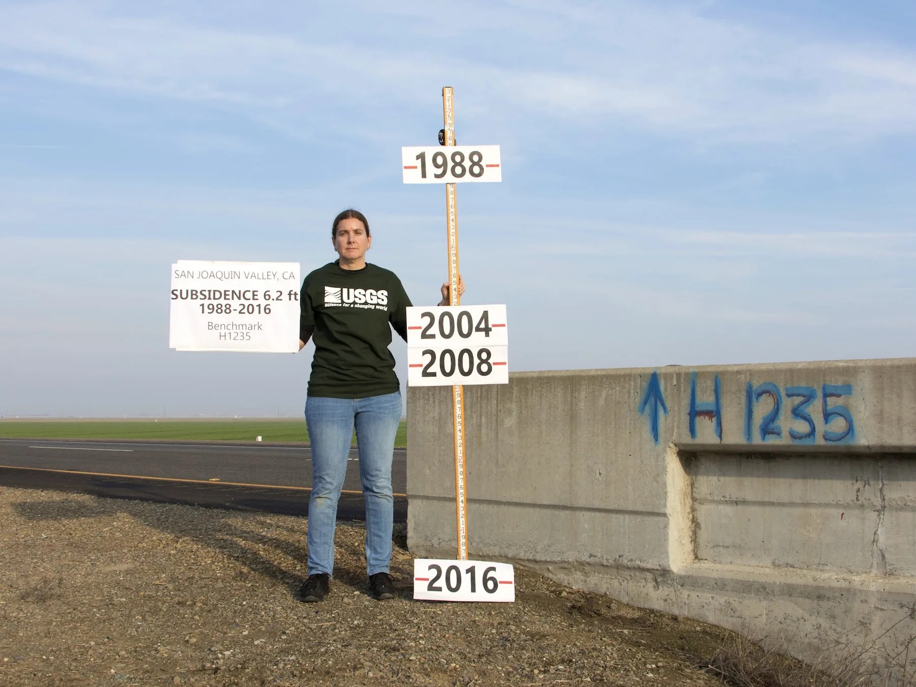 Photograph taken by Justin Brandt, USGS, of the National Geodetic Survey vertical control bench mark H1235 RESET in Merced Country, California.