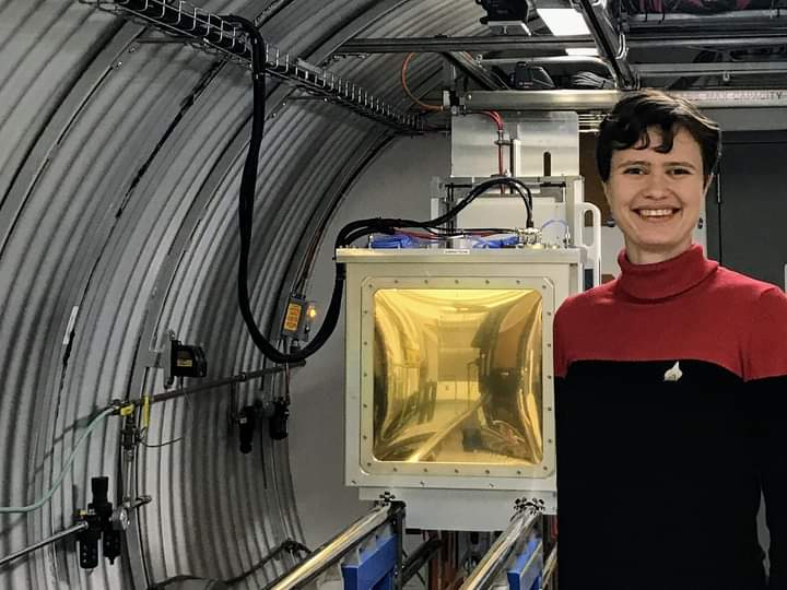 Photo of a woman with short dark hair wearing a Star Trek costume