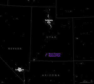 An overnight satellite photo with state lines superimposed as well as the borders of Bryce Canyon National Park shows city lights breaking through the dark landscape at Las Vegas and Salt Lake City. Bryce Canyon is, however, centered in a sea of dark.