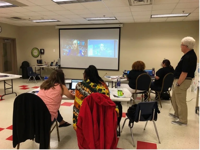 Portsmouth Public School educators experience the Challenger Center’s virtual mission Destination Mars with Flight Director Sarah Raymond.