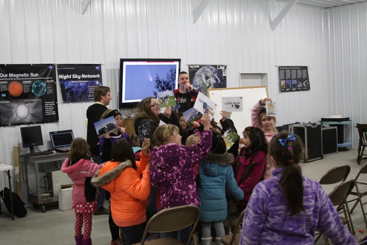 Photo of children gathered together doing an educational activity