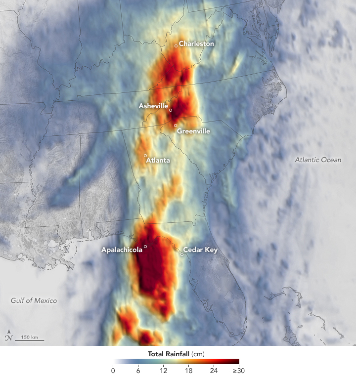 A map of the southeast United States in grayscale with a rainfall color scale overlay. The range of colors where rainfall was found spans light blue to pale yellow at 15 centimeters onto red, the darkest shade matching 30 centimeters or more. Much of the densest rainfall is off of the Florida coastline and immediately in the initial landfall region. The colors lighten over Georgia with a secondary red patch spanning from the southwest border of North Carolina into southern West Virginia.