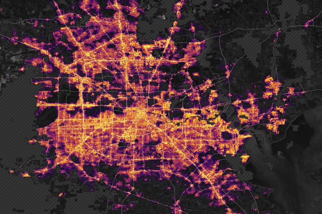 A night satellite image of greater Houston shows sprawling grids of major roadways brightly illuminated. However, there are pockets of darkness within what are highly populated areas that should be accordingly illuminated.