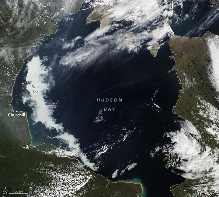 The satellite image of the Hudson Bay shows a thin strip of sea ice along the western edge of the bay.