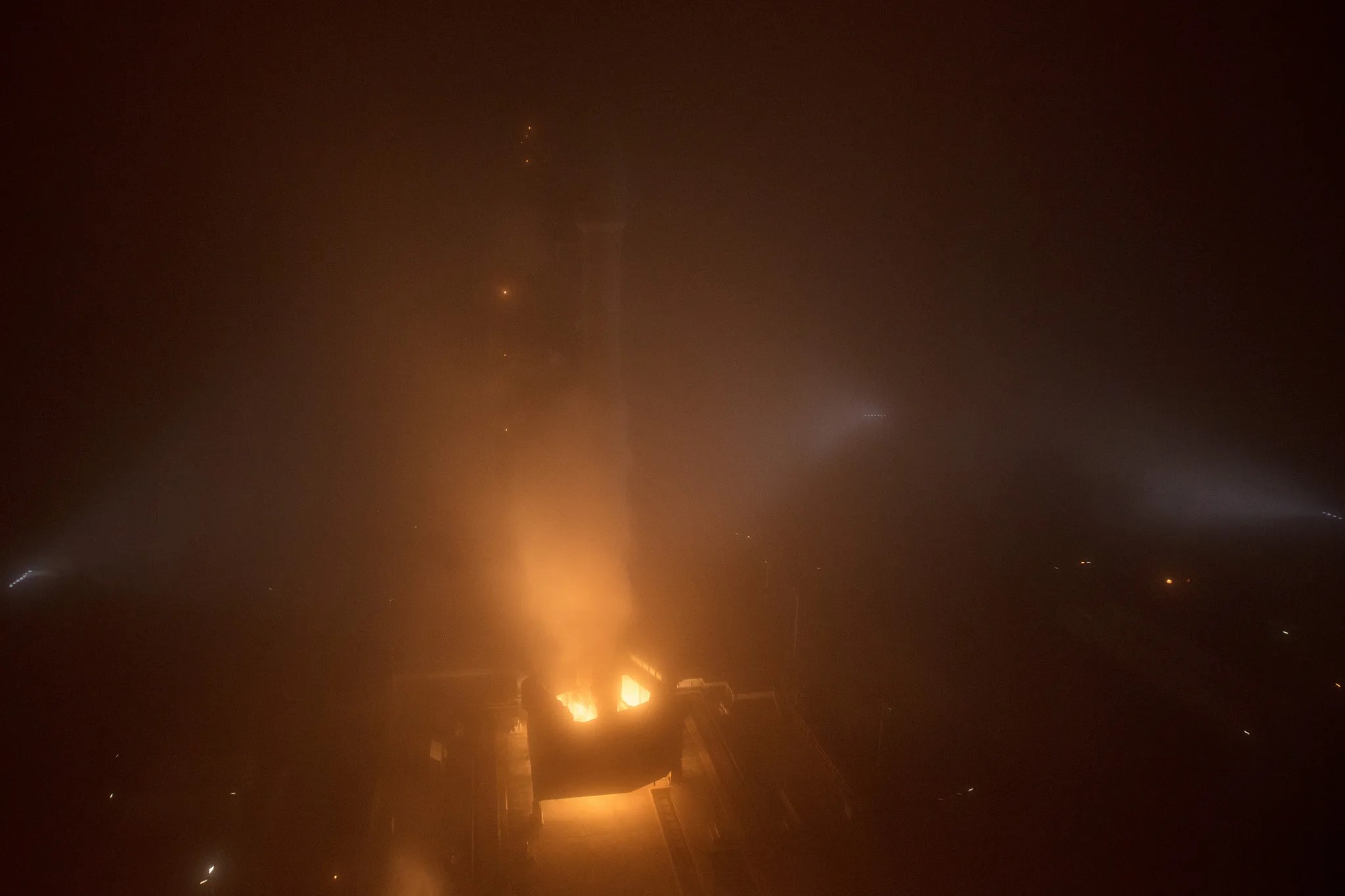 rocket on pad in fog at moment of ignition