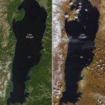 Two images of the same lake side by side. The water is a dark blue in both images. The land on the left is covered in green foliage, whereas it is largely brown on the right and there is snow covered peaks along the left side of the lake.