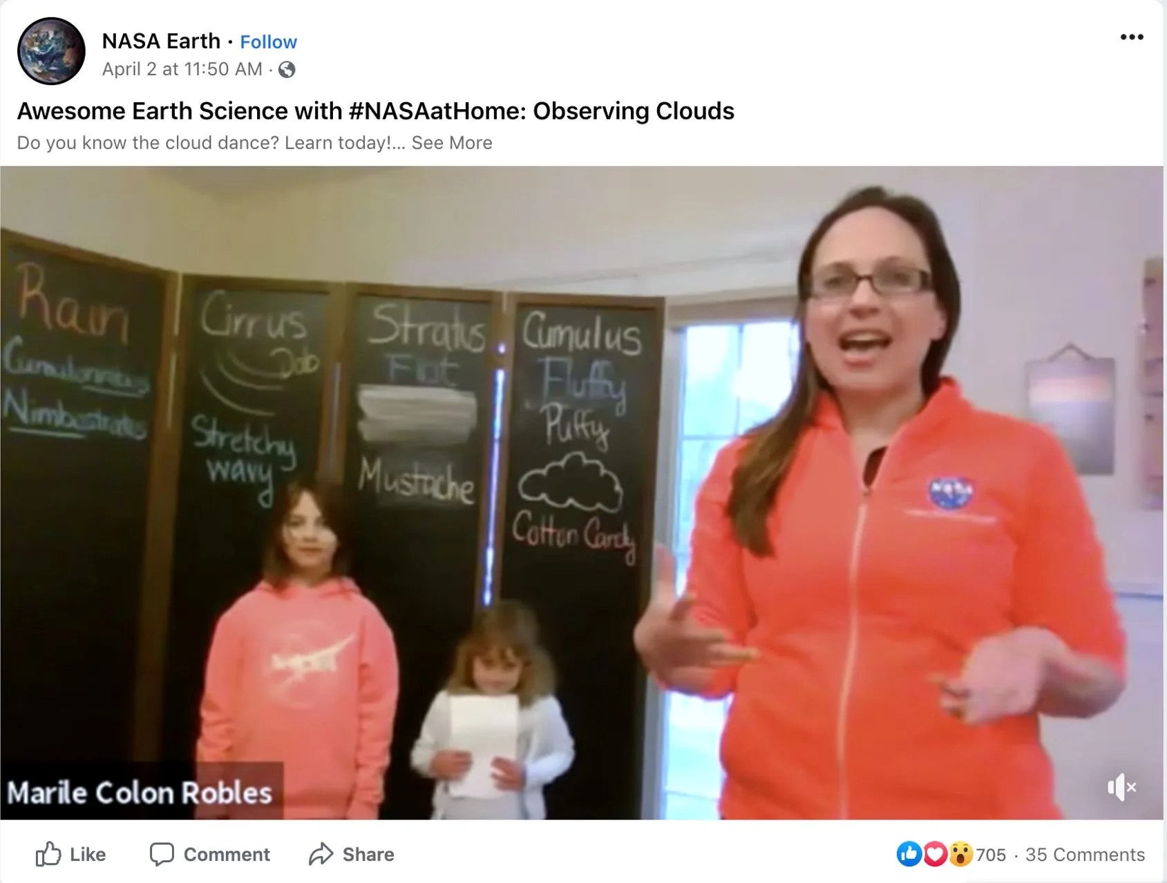 Screenshot from a video of Marilé Colón Robles and two kids in front of four vertical chalkboards. The video is titled