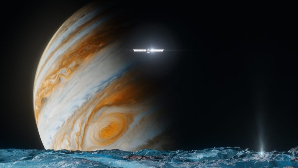 Illustration of the surface of Europa - shown as icy blue - with Jupiter behind it, and the Europa Clipper spacecraft in front of Jupiter.