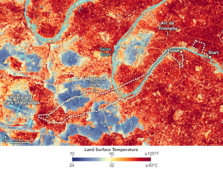 The image shows a heatscale of Paris. Notable features of the city are highlighted, as is the marathon route. While there are vegetated areas that display in the cooler blue color temperature the majority of the map shows up in red.