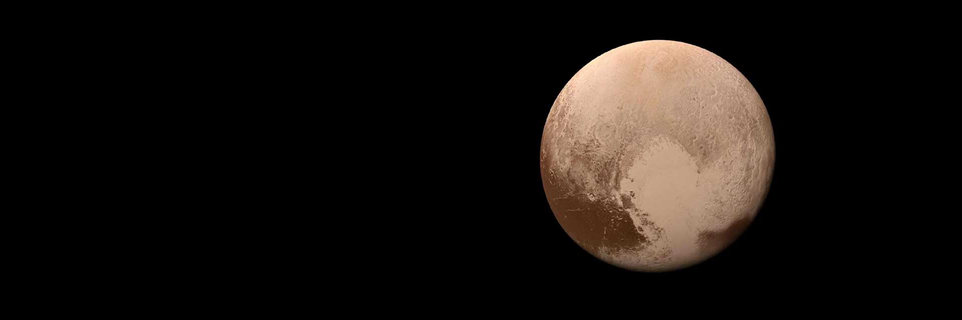 Dwarf planet Pluto with a heart-shaped feature showing.