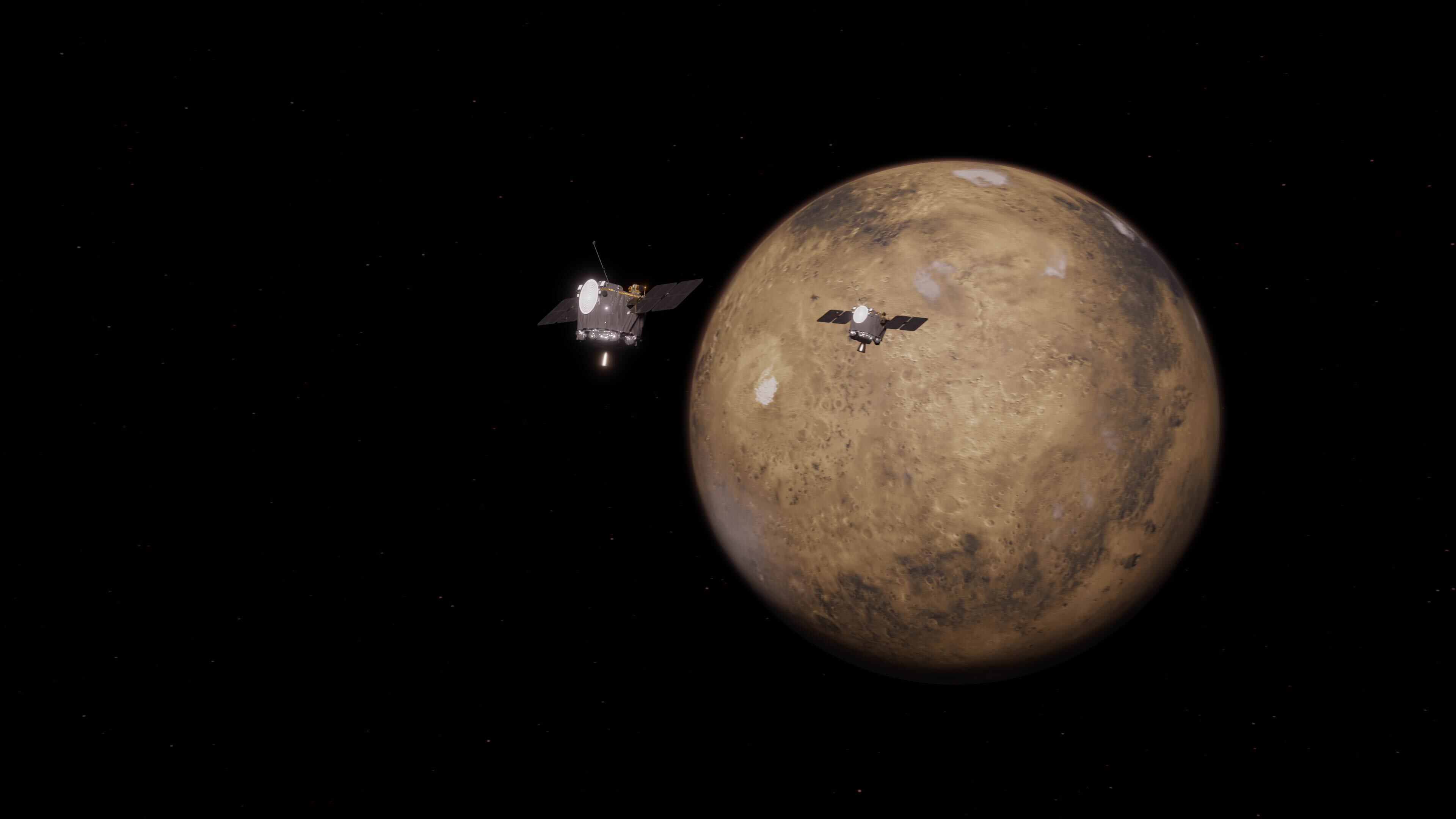 An animation showing Mars against a black background. Two spacecraft – like short gray cyclinders with flat panels on the right and left – orbit the planet.