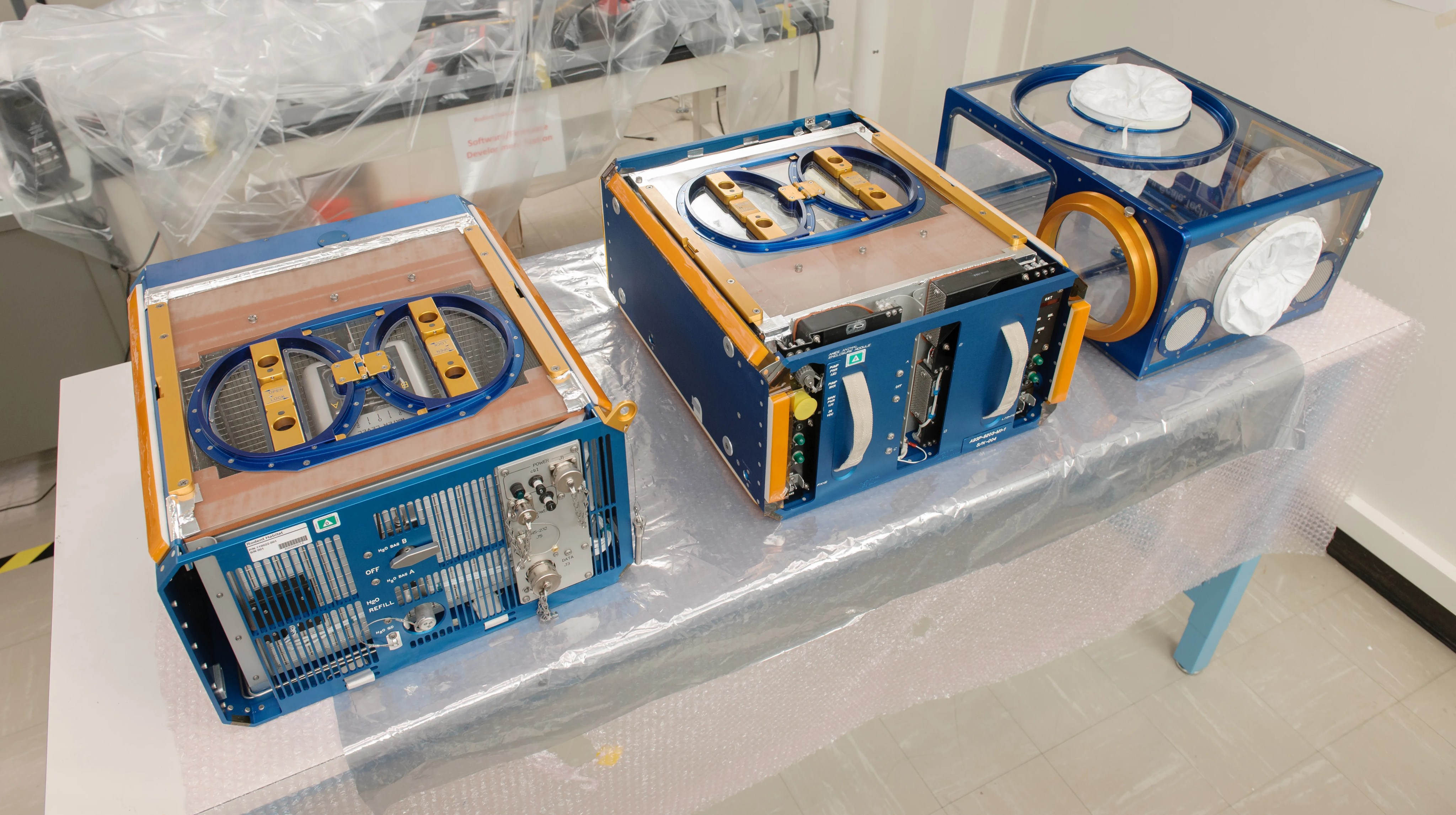 The Rodent Research Hardware System includes three modules: (left) habitat, (center) transporter, and (right) animal access unit