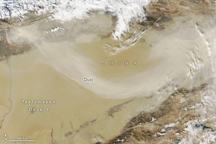 Flanked by mountain ranges on three sides, the basin in northwestern China sees frequent dust storms.