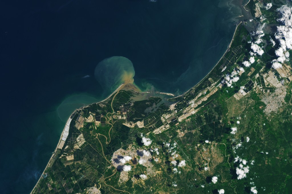 Green and white aquaculture ponds extend across the Tumbes River Delta shown in this image, acquired on March 14, 2024, by the OLI-2 (Operational Land Imager-2) on Landsat 9. The ponds on the west side of the delta are likely topped with white pond covers, providing some shade.