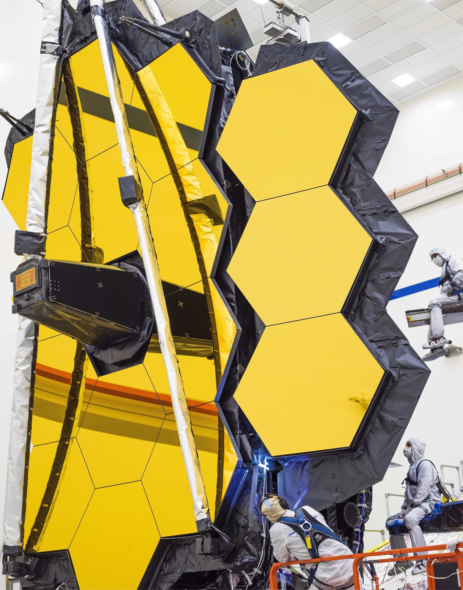 Engineers look on as James Webb’s Golden Mirror Wings Open One Last Time on Earth.