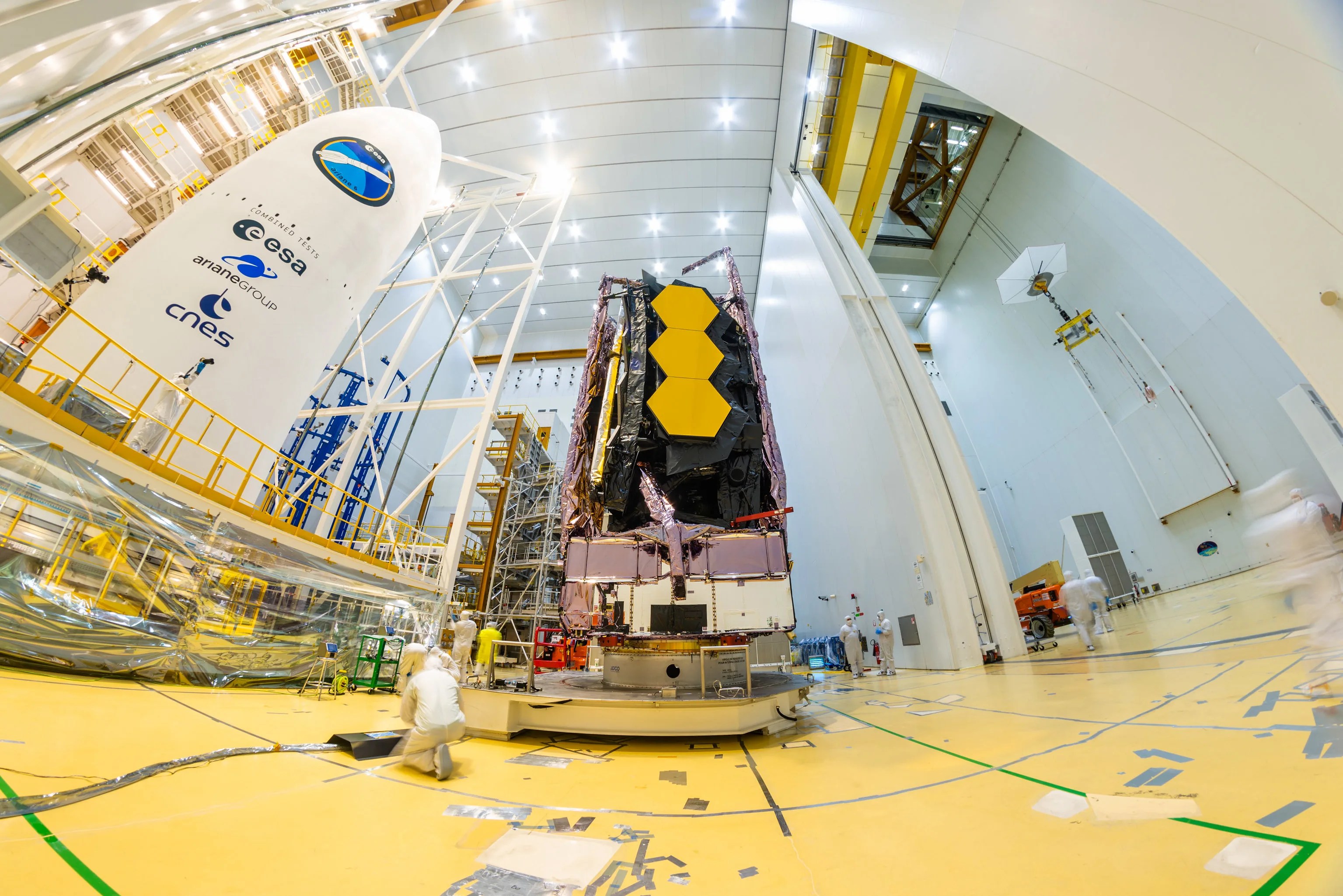 Engineer work on as Webb Placed on Top of Ariane 5