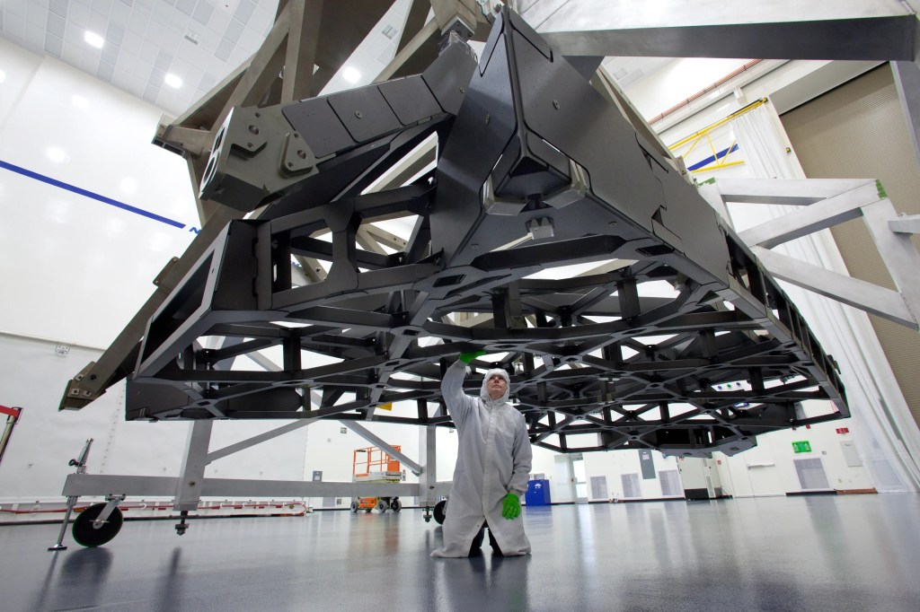 A technician examines the backplane pathfinder