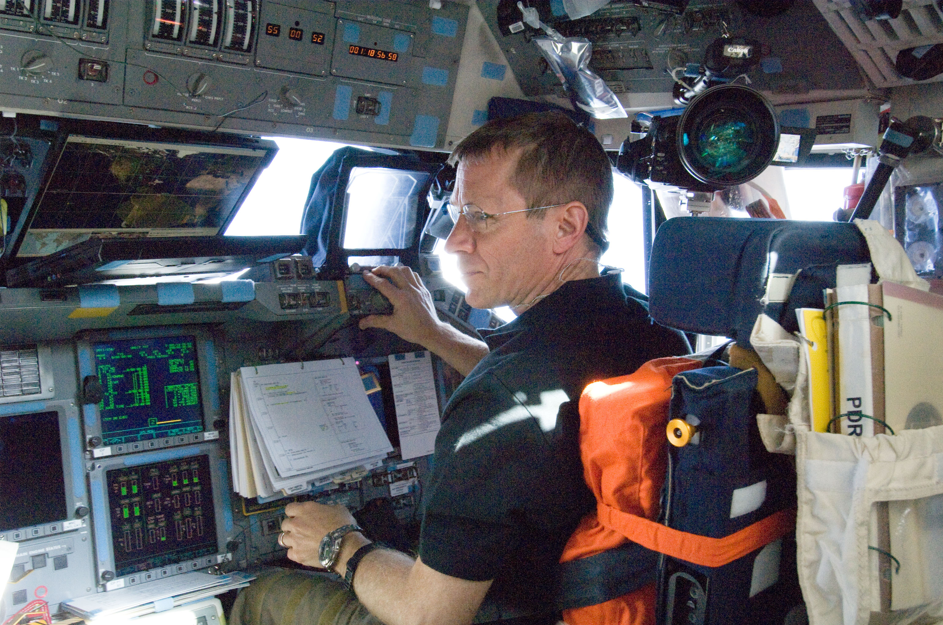 The shuttle pilot is at his station on the flight deck.