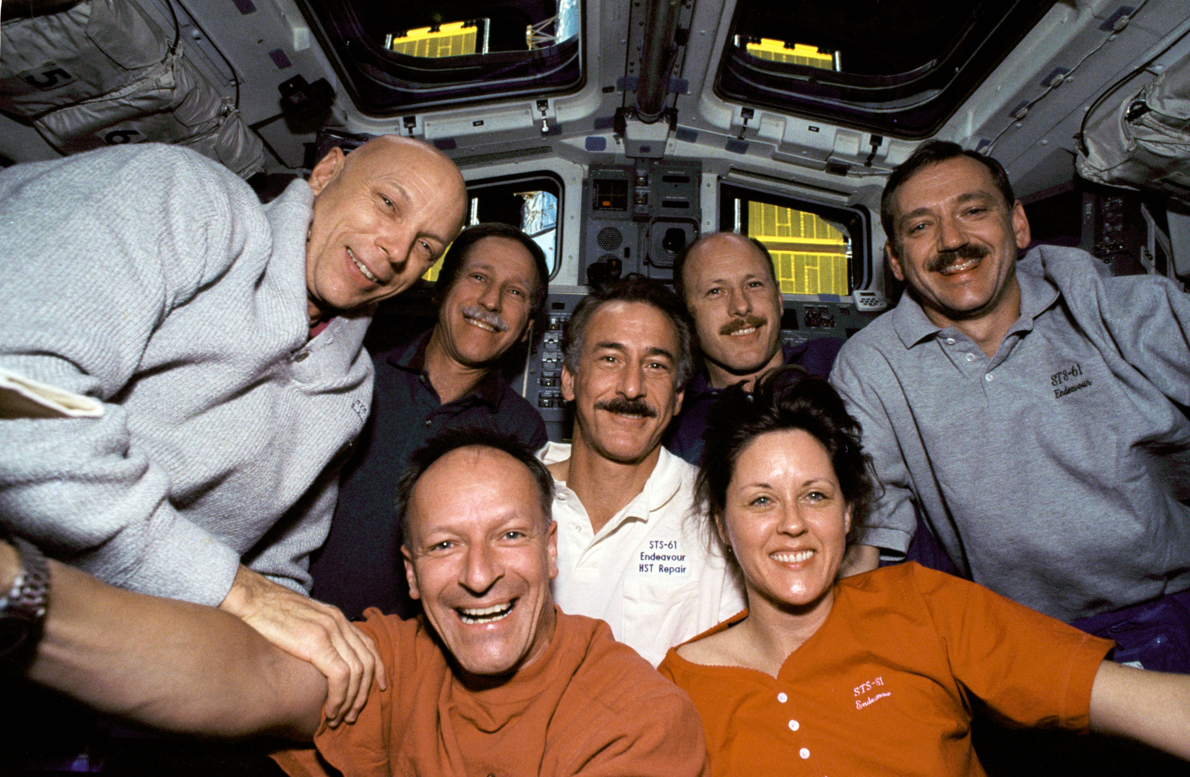 The crew of Hubble servicing mission 1 floats for a team picture.