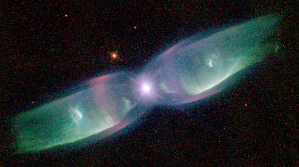 Bright white star in the center of the image, with two bright blueish green plumes of dust and gas on either side moving away from the center star.