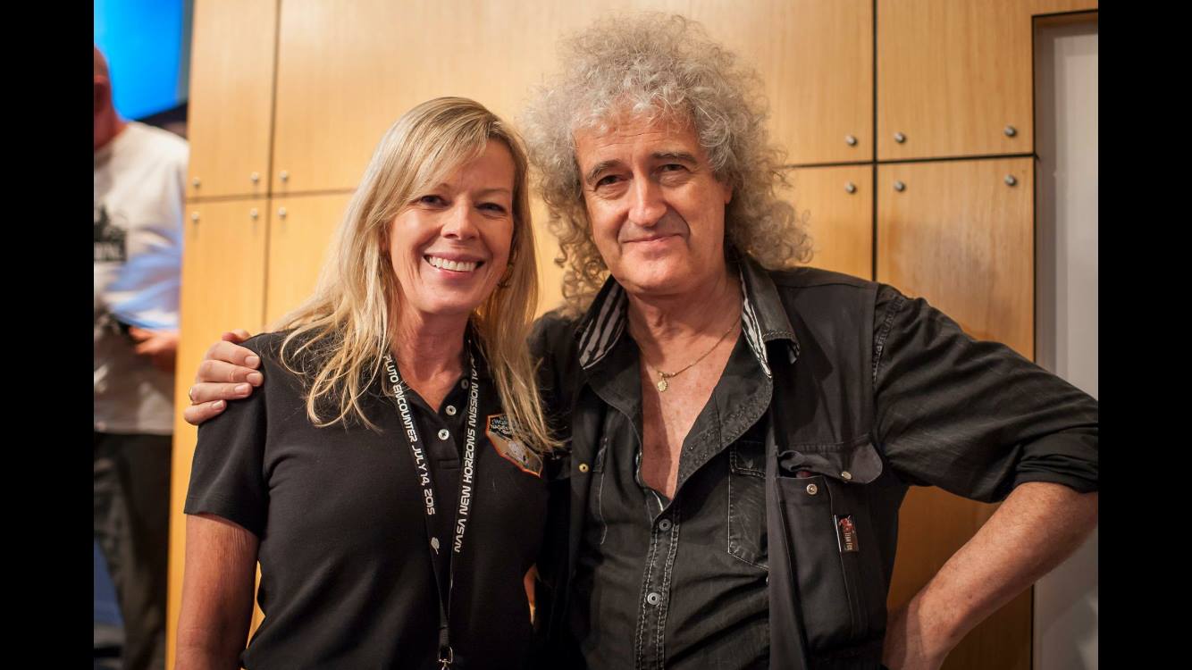 With Queen guitarist and astrophysicist Brian May at Pluto flyby