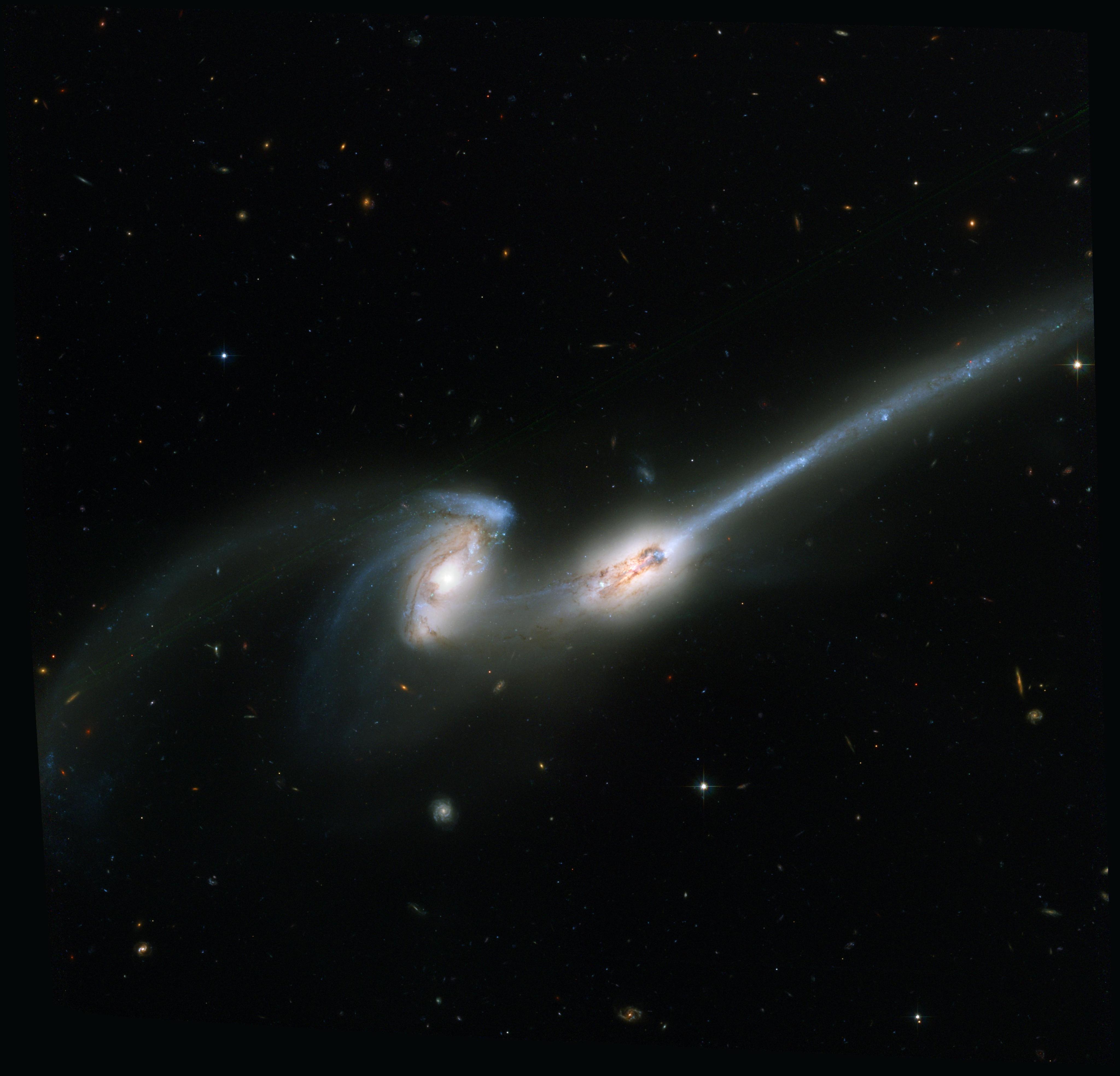 Two galaxies interacting that look like mice with tails.
