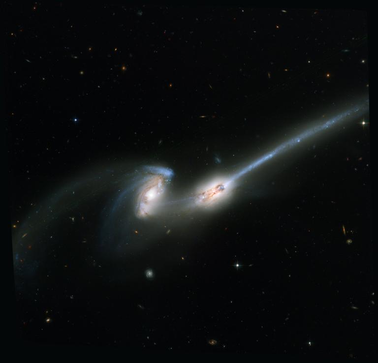 Two galaxies interacting that look like mice with tails.