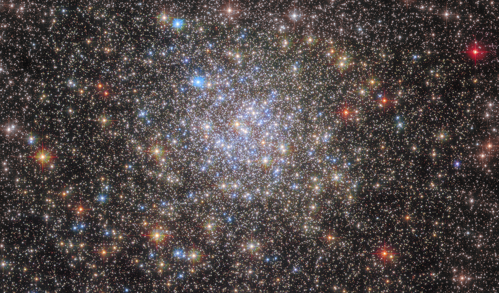 A massive cluster of blue, red, yellow, and white stars.