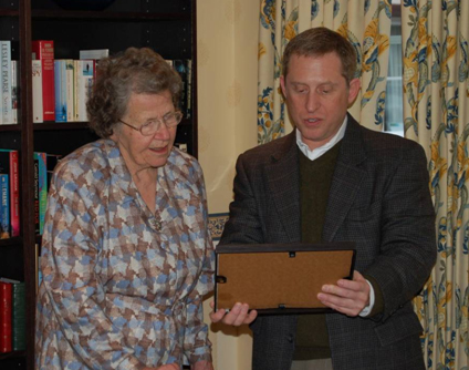 Alan Stern presents a plaque to Venetia Burney Phair
