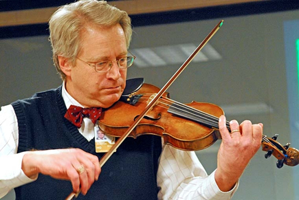 Gordon Johnston is wears a snappy bowtie as he plays the fiddle.