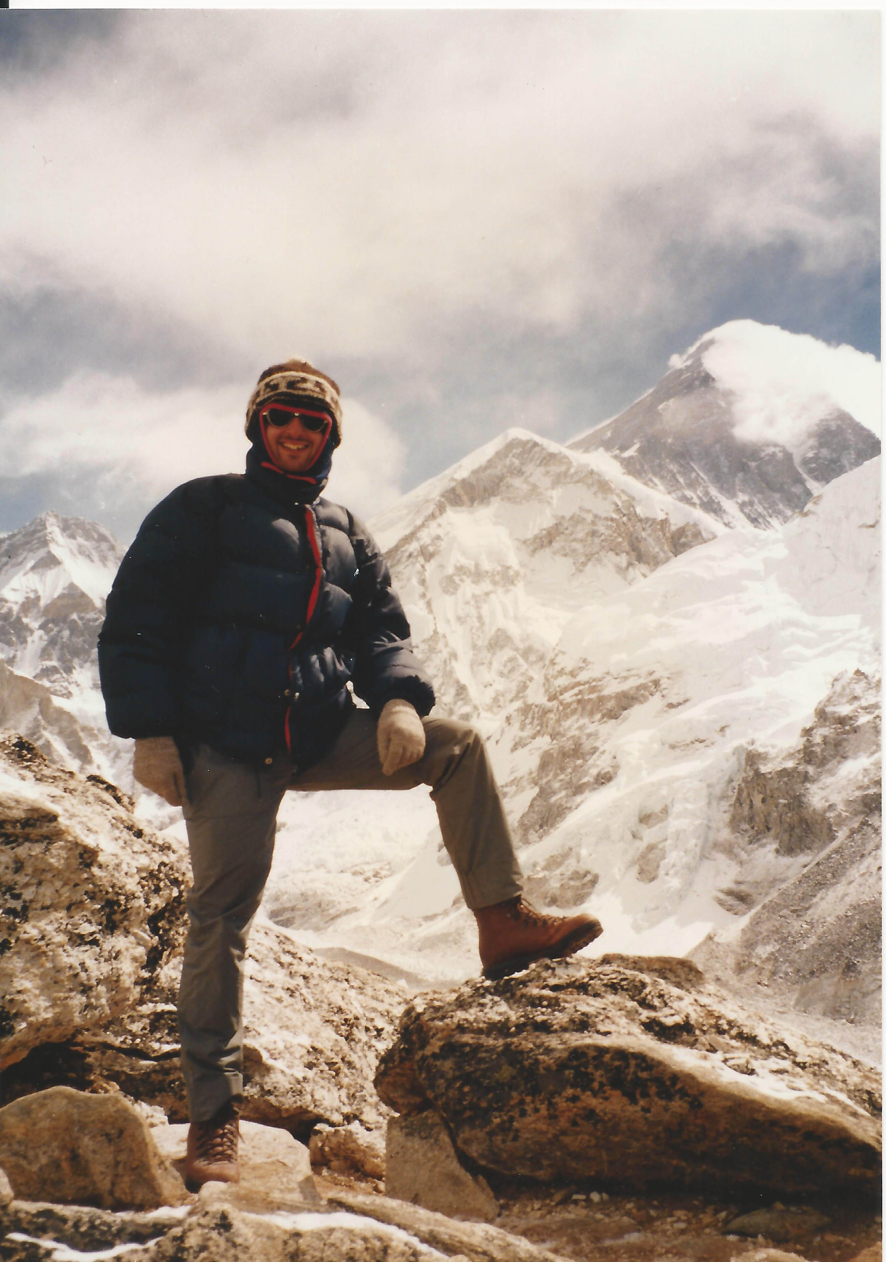 Man posing near the top of Mt. Everest after a climb