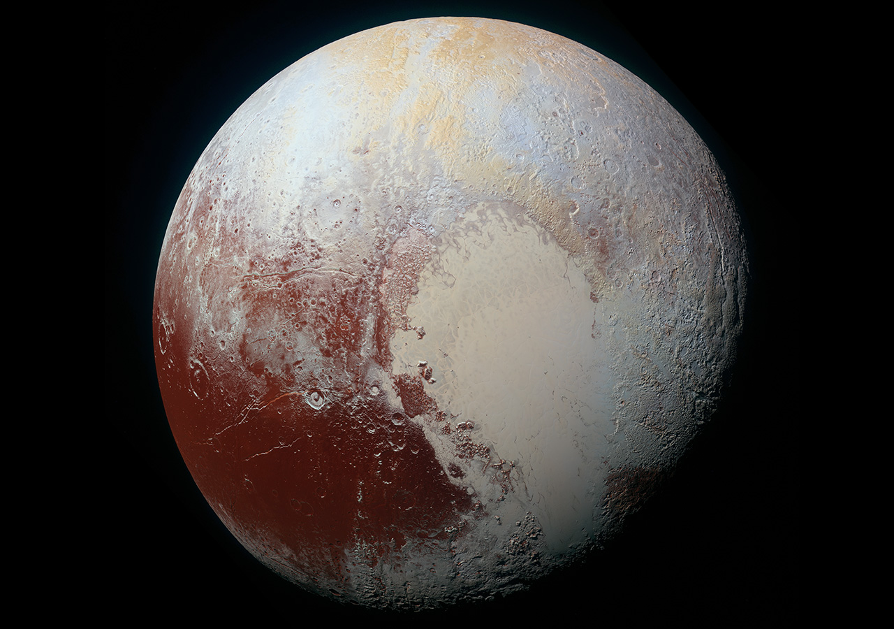 View of Pluto in space, featuring the heart-shaped bright area amidst the dark reds, pinks, and purples of its icy landscape.
