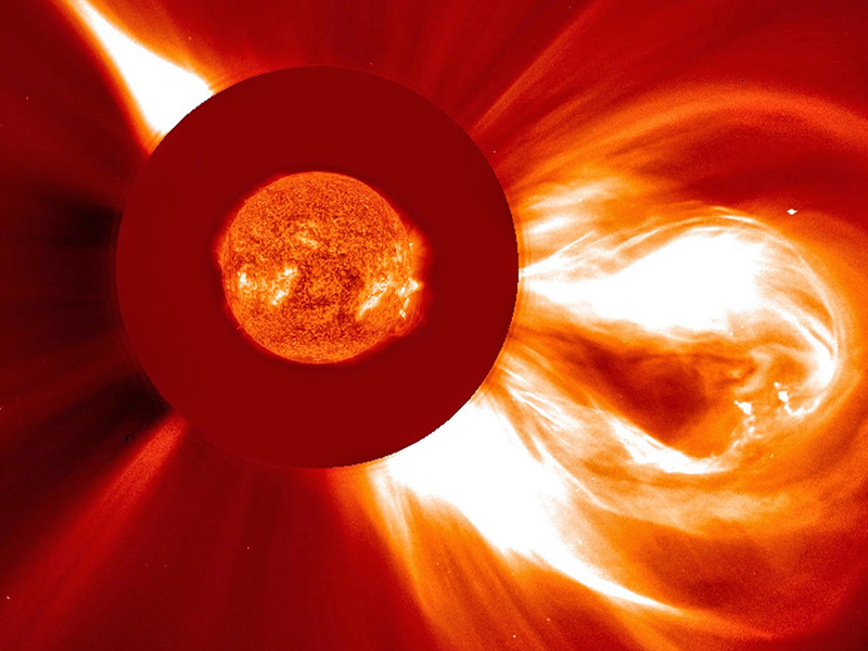 A bright looping burst of material flows off the Sun