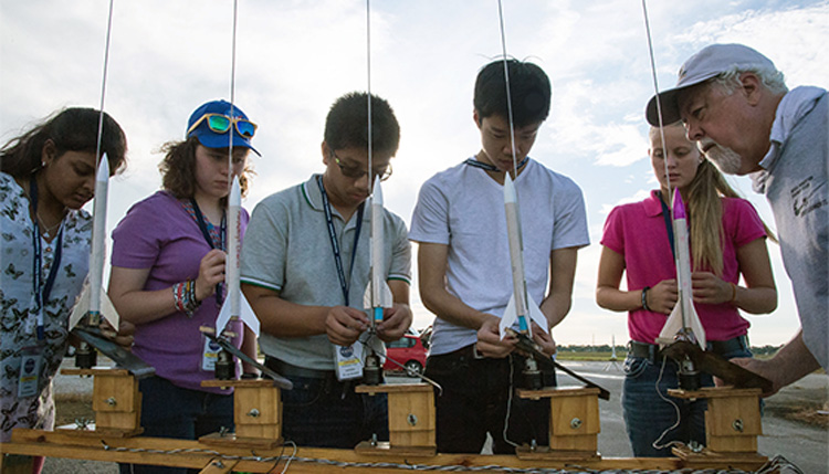 High school students build and launch model rockets during one of NASA's many education activities