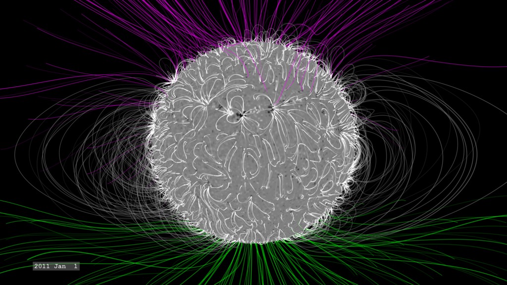 High-resolution still image of the solar magnetic field showing magnetic field lines in different colors.