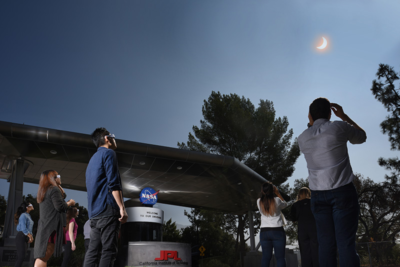 Employees and visitors at NASA's Jet Propulsion Laboratory stopped to watch the Aug. 21, 2017, solar eclipse on Aug. 21, 2017.