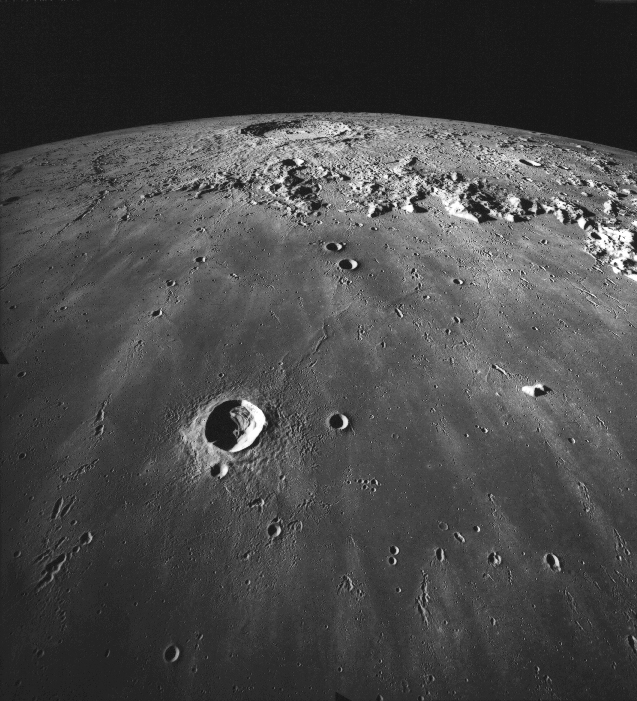 Moon's surface with the crater Copernicus, 93 kilometers in diameter, in the distance.