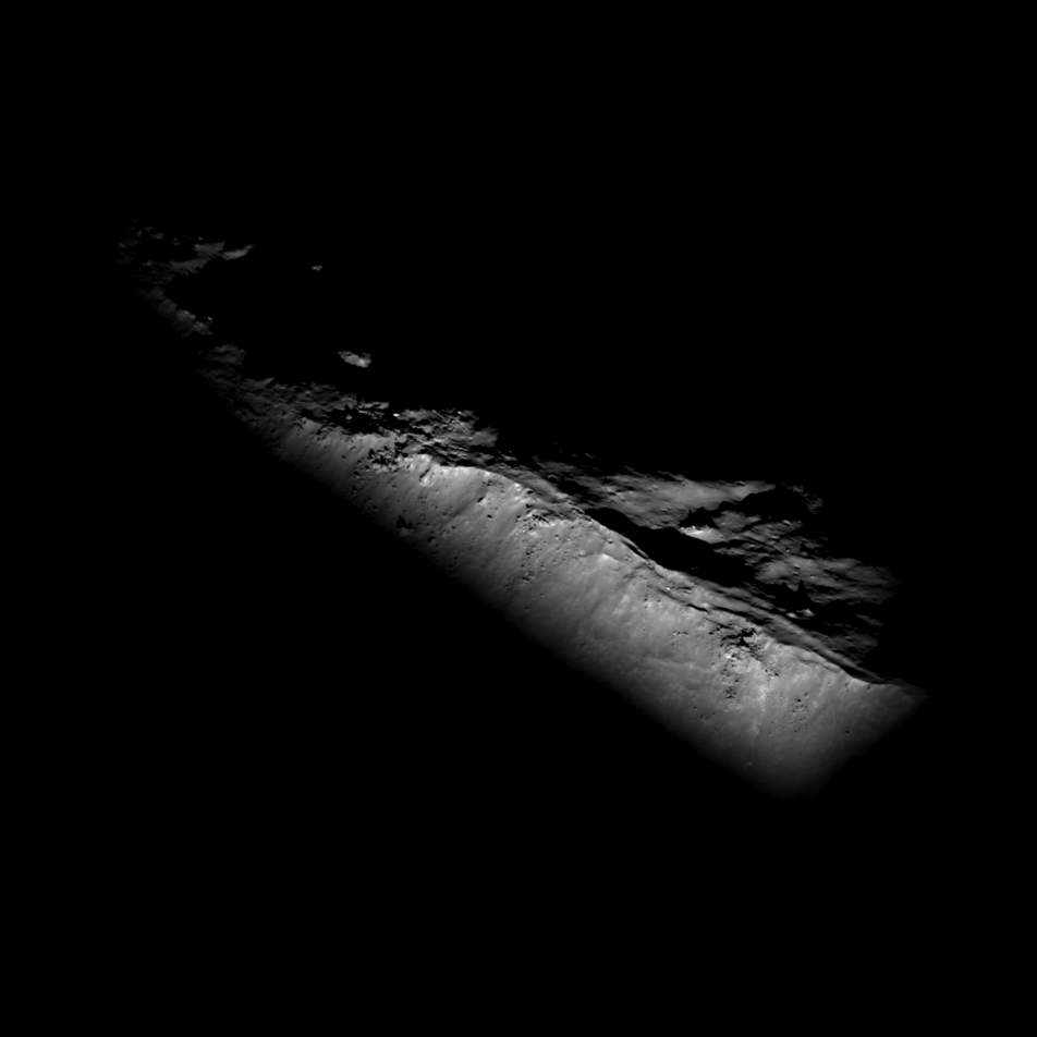 Black and white image of ridge emerging from shadows on the Moon.