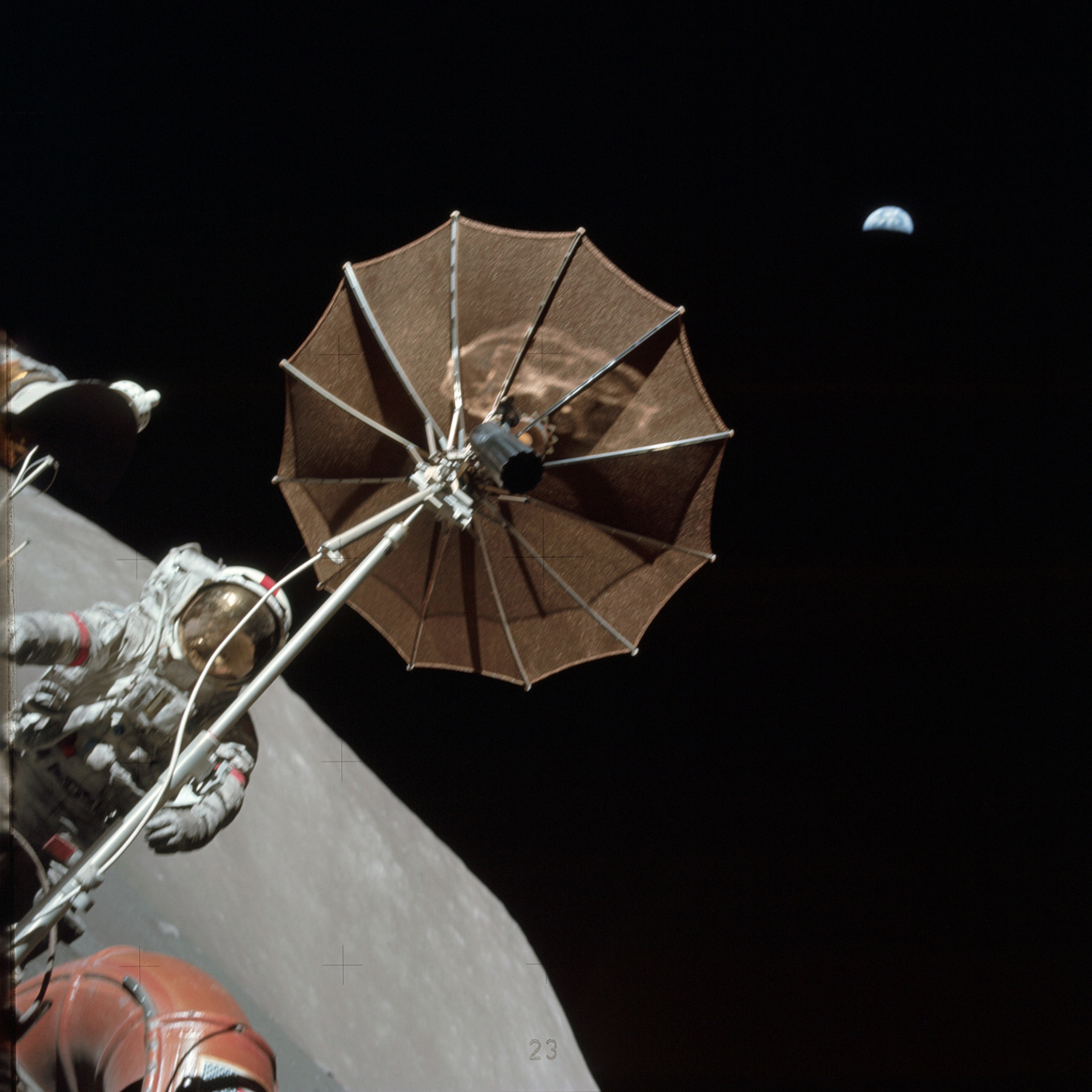 Astronaut on Moon holding antenna with distant Earth in the background