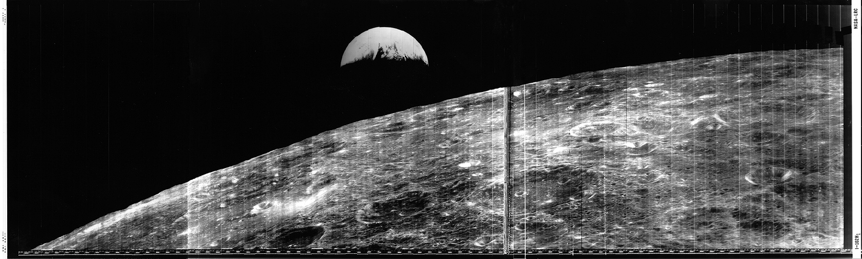 View of Earth over the Moon's horizon. Image looks high-contrast and vintage. 