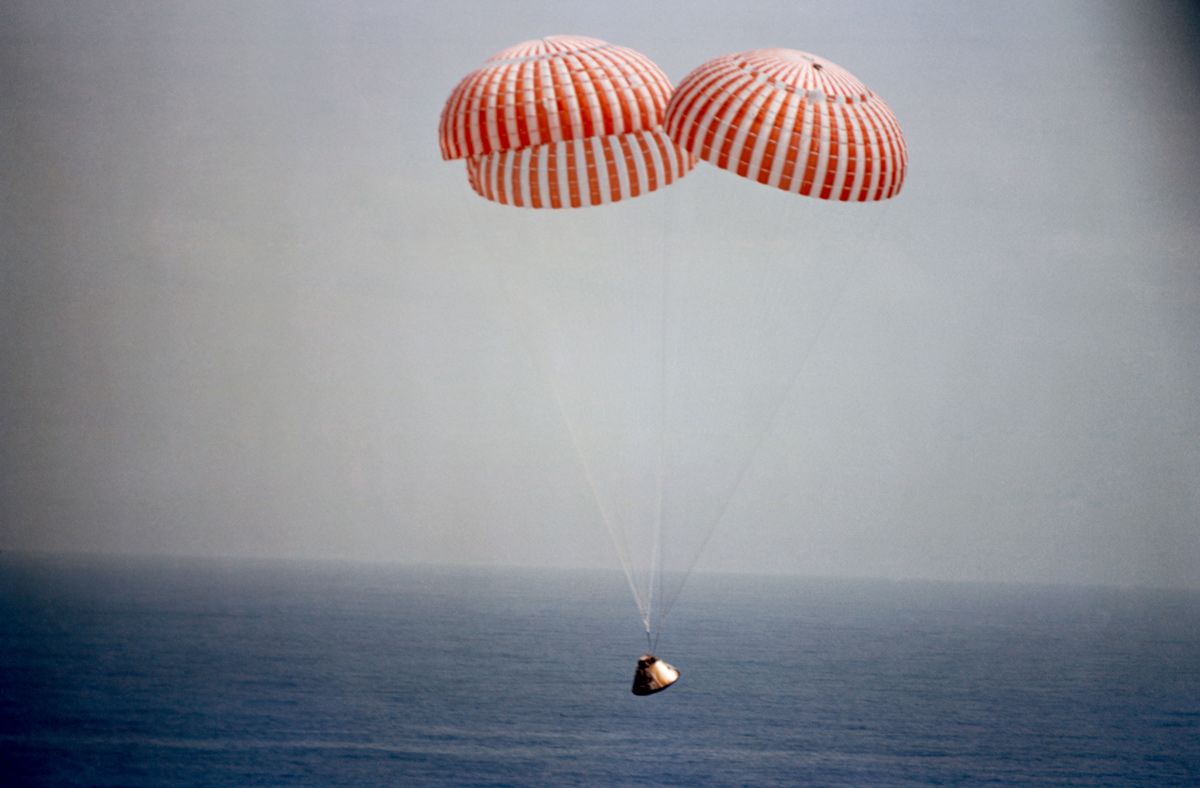 Apollo 9 spacecraft approaching splashdown with parachutes deployed