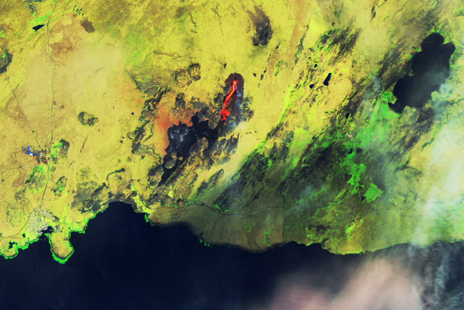 Lava is once again spilling from the volcano in southwest Iceland, only this time it is igniting moss fires